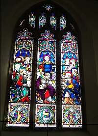 The 'Last Supper' window over the altar in memory of Sophia Mirabella Sandilands, wife of the rector 1859